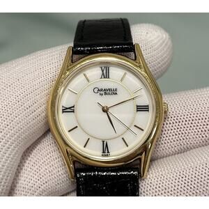 Caravelle by Bulova 42A57 Gold Tone Watch White Roman Numeral Dial Leather Strap